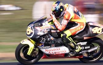 Current points leader Valentino Rossi of Italy peels back his visor screen during the first qualifying session of the 1999 Australian 250cc Motorcycle Grand Prix on Phillip Island 01 October.  Rossi set the seventh fastest lap time of 1:34.863 for the 4.45km road circuit before losing control of his Aprilia.  (ELECTRONIC IMAGE)  AFP PHOTO/Torsten BLACKWOOD