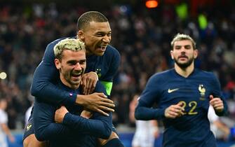 LILLE, FRANCE - OCTOBER 17: Kylian Mbappe #10 of France celebrates his first goal with Antoine Griezmann #7 during the friendly game between France and Scotland at Decathlon Arena on October 17, 2023 in Lille, France (Photo by Christian Liewig - Corbis/Corbis via Getty Images)