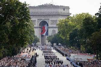 Troops march during the Bastille Day military parade along the Avenue Foch, with the Arc de Triomphe in the background in Paris, on July 14, 2024. (Photo by Ludovic MARIN / AFP) (Photo by LUDOVIC MARIN/AFP via Getty Images)