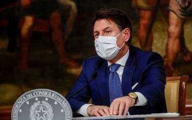 ROME, ITALY - DECEMBER 03: Italian Prime Minister Giuseppe Conte holds a press conference to announce a new emergency decree on Coronavirus restrictions, at Palazzo Chigi, on December 3, 2020 in Rome, Italy. Today Italian Prime Minister Giuseppe Conte signed a new decree (DPCM) to contain the spread of COVID-19 pandemic. Under the new decree, which is set to come into force from December 4 until January 6, people will only be allowed to be out of the home from 22:00 to 05:00 for work or health reasons. The movement between regions will be banned from December 21 until January 6 and it will not be possible to move outside one's town or city of residence on Christmas Day, St Stephen's Day and New Year's Day. Italy registered 23225 new infections and 993 deaths from Covid-19 in the last 24 hours. (Photo by AM POOL/Augusto Casasoli / AM POOL via Getty Images)