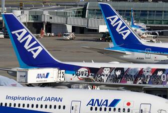 epa10594117 All Nippon Airways (ANA) aircrafts taxi on the tarmac at Haneda Airport in Tokyo, Japan, 27 April 2023. Japan's airline ANA Holdings Inc. reported an annual profit for the first time in three fiscal years after Japan relaxed its COVID-19 border control, posting a net profit of 89.4 billion yen (606 million euros) in the fiscal year ended March 2023.  EPA/FRANCK ROBICHON