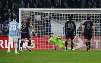 Lazio's Ciro Immobile (L) scores on penalty the 1-0 goal during the UEFA Champions League round of 16 first leg soccer match SS Lazio vs FC Bayern Munich at Olimpico stadium in Rome, Italy, 14 February 2024. ANSA/ANGELO CARCONI