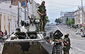 epaselect epa10709120 Servicemen from Private military company (PMC) Wagner Group block a street in downtown Rostov-on-Don, southern Russia, 24 June 2023. Security and armoured vehicles were deployed after private military company (PMC) Wagner Group s chief Yevgeny Prigozhin said in a video that his troops had occupied the building of the headquarters of the Southern Military District, demanding a meeting with Russia s defense chiefs.  EPA/ARKADY BUDNITSKY