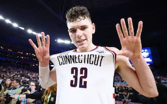 GLENDALE, ARIZONA - APRIL 08: Donovan Clingan #32 of the Connecticut Huskies celebrates after defeating the Purdue Boilermakers in the NCAA Men's Basketball Tournament National Championship game at State Farm Stadium on April 08, 2024 in Glendale, Arizona. (Photo by Jamie Schwaberow/NCAA Photos via Getty Images)