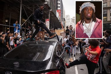 People jump on a car during riots sparked by Twitch streamer Kai Cenat, who announced a "givaway" event, in New York's Union Square on August 4, 2023. A New York influencer sparked a surprise gathering of around 2,000 young people in Manhattan on Friday afternoon that degenerated into street violence and left a number of people injured, police announced and arrested.
It all began on Friday, August 4, with a call, on Instagram, from 21-year-old African-American streamer Kai Cenat to meet him in lower Manhattan for a distribution, broadcast live on social networks, of gifts, including PlayStations 5 game consoles. (Photo by Yuki IWAMURA / AFP) (Photo by YUKI IWAMURA/AFP via Getty Images)