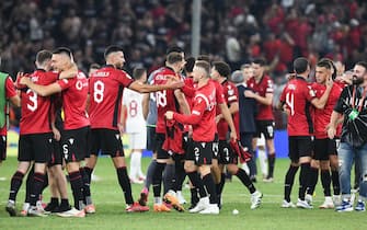 epa10853607 Albanian national soccer team player celebrate after winning the UEFA EURO 2024 qualifying soccer match between Albania and Poland in Tirana, Albania, 10 September 2023.  EPA/Andrzej Lange POLAND OUT