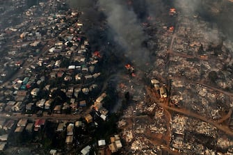 Aerial view of the forest fire that affects the hills of the city of ViÃ±a del Mar in the Las Pataguas sector, Chile, taken on February 3, 2024. The region of Valparaoso and ViÃ±a del Mar, in central Chile, woke up on Saturday with a partial curfew to allow the movement of evacuees and the transfer of emergency equipment in the midst of a series of unprecedented fires, authorities reported. (Photo by Javier TORRES / AFP) (Photo by JAVIER TORRES/AFP via Getty Images)