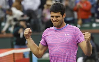 epa11221464 Carlos Alcaraz of Spain reacts after defeating Alexander Zverev of Germany during the quarterfinals of the BNP Paribas Open in Indian Wells, California, USA, 14 March 2024.  EPA/JOHN G. MABANGLO