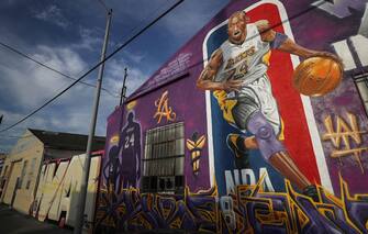 LOS ANGELES, CALIFORNIA - FEBRUARY 13: A mural depicting deceased NBA star Kobe Bryant and his 13-year-old daughter Gianna, painted by @theoneplek and @tetriswai, is displayed on a building on February 13, 2020 in Los Angeles, California. Numerous murals depicting Bryant and Gianna have been created around greater Los Angeles following their tragic deaths in a helicopter crash which left a total of nine dead. A public memorial service honoring Bryant will be held February 24 at the Staples Center in Los Angeles, where Bryant played most of his career with the Los Angeles Lakers.  (Photo by Mario Tama/Getty Images)