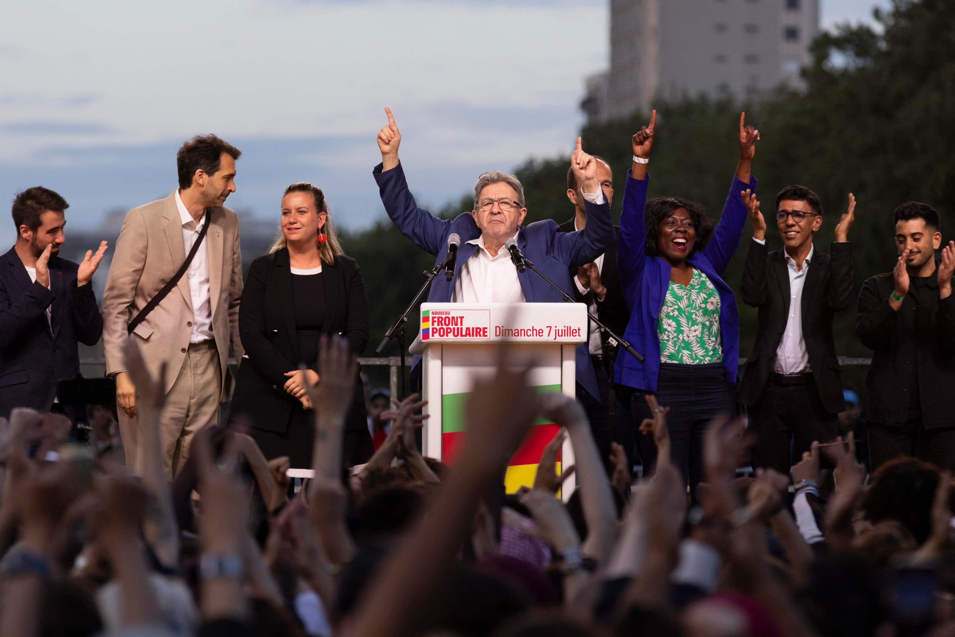 epaselect epa11465995 Leader of La France Insoumise (LFI) Jean-Luc Melenchon (C), flanked by LFI members, speaks after the announcement of the results of the second round of the legislative elections in Paris, France, 07 July 2024. France voted in the second round of the legislative elections on 07 July. According to the first official results, the left-wing New Popular Front (Nouveau Front populaire, NFP) was ahead of President Macron's party and Le Pen's far-right National Rally (RN).  EPA/ANDRE PAIN