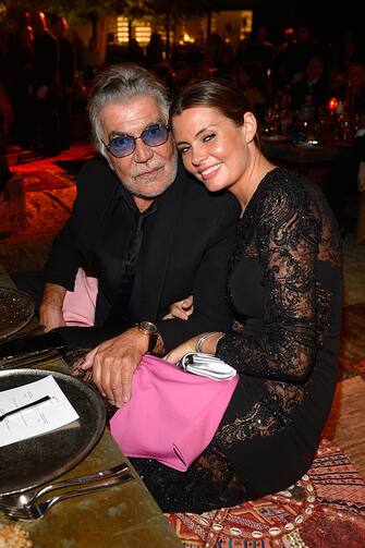 DUBAI, UNITED ARAB EMIRATES - OCTOBER 31:  Roberto Cavalli and Sandra J Bergman at the Gala Event during the Vogue Fashion Dubai Experience on October 31, 2014 in Dubai, United Arab Emirates.  (Photo by Luca Teuchmann/Getty Images for Vogue & The Dubai Mall)