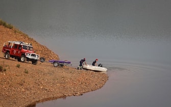 Portuguese firefighters launch a boat during a new search operation amid the investigation into the disappearance of Madeleine McCann (Maddie) in the Arade dam, in Silves, near Praia da Luz, on 23 May, 2023. This operation stems from a European Investigation Order addressed by the German authorities to Portugal and focuses on the Arade dam, located about 50 kilometers from Praia da Luz, the place where the child disappeared in May 2007, 16 years ago, while on vacation with her parents. (Photo by FILIPE AMORIM / AFP) (Photo by FILIPE AMORIM/AFP via Getty Images)