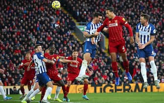 LIVERPOOL, ENGLAND - NOVEMBER 30:  Virgil van Dijk (R) of Liverpool scores his teams first goal with header during the Premier League match between Liverpool FC and Brighton & Hove Albion at Anfield on November 30, 2019 in Liverpool, United Kingdom. (Photo by Clive Brunskill/Getty Images)