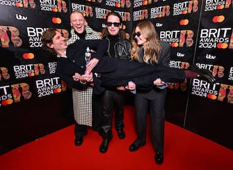 Mandatory Credit: Photo by James Veysey/Shutterstock (14368873t)
Group of the Year - Jungle - pictured with their manager
BRIT Awards 2024, Press Room, The O2 Arena, London, UK - 02 Mar 2024