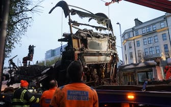 A burned out Luas is removed from O'Connell Street in Dublin, in the aftermath of violent scenes in the city centre on Thursday evening. The unrest came after an attack on Parnell Square East where five people were injured, including three young children. Picture date: Friday November 24, 2023.