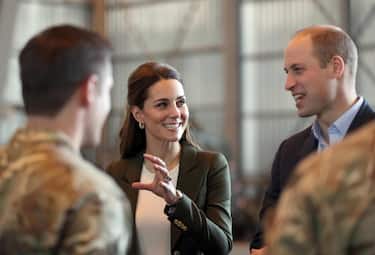 epa07209984 Britain's Prince William, Duke of Cambridge (R) and Catherine, Duchess of Cambridge (C) meet members of 31 SQN and other operational personnel in a hangar at RAF Akrotiri in Cyprus, 05 December 2018. The Duke and Duchess carry out a series of engagements on the Royal Air Force base, meeting with serving personal and members of the local community.  EPA/ANDREW MATTHEWS / POOL