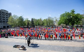 epa12066905 Supporters of the Socialist Party attend a rally to mark International Workers' Day in front of the National Opera in Chisinau, Moldova, 01 May 2025. Labor Day, or May Day, is observed worldwide on 01 May to celebrate the economic and social achievements of workers as well as to fight for workers' rights.  EPA/DUMITRU DORU