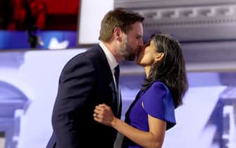 MILWAUKEE, WI JULY 17, 2024 --- Republican vice presidential candidate Sen. J.D. Vance kisses his wife Usha Chilukuri Vance while Vance's mom Beverly, back right, looks on during the Republican National Convention on Wednesday, July 17, 2024. (Robert Gauthier / Los Angeles Times via Getty Images)