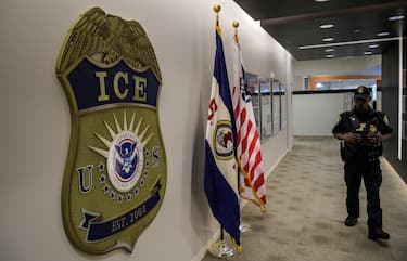 WASHINGTON, DC - MAY 11: A law enforcement officer walks past ICE logo ahead of a press conference on Thursday, May 11, 2017, at the U.S. Immigration and Customs Enforcement headquarters in Washington, DC. (Photo by Salwan Georges/The Washington Post via Getty Images)
