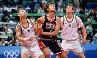 BARCELONA - 1992: Christian Laettner #4 of the United States boxes out against Detlef Schrempf #11 of Germany during the 1992 Olympics in Barcelona, Spain.  NOTE TO USER: User expressly acknowledges that, by downloading and or using this photograph, User is consenting to the terms and conditions of the Getty Images License agreement. Mandatory Copyright Notice: Copyright 1992 NBAE (Photo by Andrew D. Bernstein/NBAE via Getty Images)