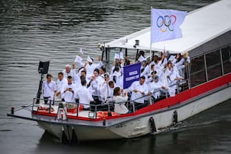 PARIS, FRANCE - JULY 26: The Refugee Olympic Team and flagbearer Cindy Ngamba (Boxing) cruise during the athletesâ   parade on the River Seine during the Opening Ceremony of the Olympic Games Paris 2024 on July 26, 2024 in Paris, France. (Photo by Markus Gilliar - GES Sportfoto/Getty Images)