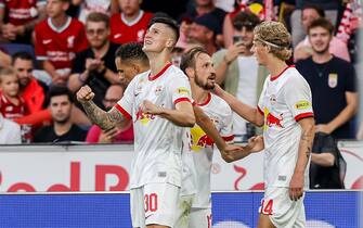SALZBURG, AUSTRIA - JULY 27: Benjamin Sesko of Red Bull Salzburg celebrates after scoring his team's first goal with teammates during the pre-season friendly match between FC Red Bull Salzburg and FC Liverpool at Red Bull Arena on July 27, 2022 in Salzburg, Austria. (Photo by Roland Krivec/DeFodi Images via Getty Images)