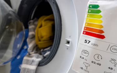 04 June 2022, Berlin: A sticker indicating the energy efficiency class is affixed to a washing machine. Photo: Monika Skolimowska/dpa (Photo by Monika Skolimowska/picture alliance via Getty Images)