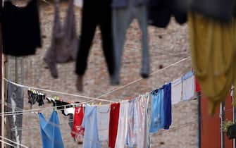 Typical view the streets of Venice washed clothes drying on cords outside the building. (Photo by: Godong/Universal Images Group via Getty Images)