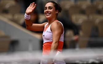Italy's Martina Trevisan celebrates after victory over Canada's Leylah Fernandez in their women's singles match on day ten of the Roland-Garros Open tennis tournament at the Court Philippe-Chatrier in Paris on May 31, 2022. (Photo by Anne-Christine POUJOULAT / AFP) (Photo by ANNE-CHRISTINE POUJOULAT/AFP via Getty Images)