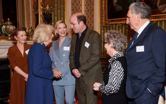 LONDON, ENGLAND - FEBRUARY 18: British Queen Camilla speaks with actors (L-R) Lesley Manville, Cate Blanchett, Rory Kinnear, Imelda Staunton and Jim Carter, as she attends a reception for staff, actors and supporters of the National Theatre at Buckingham Palace on February 18, 2025 in London, England. (Photo by Isabel Infantes - WPA Pool/Getty Images)