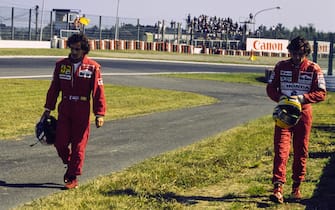 SUZUKA, JAPAN - OCTOBER 21: Alain Prost and Ayrton Senna walk away following their collision at the start of the race during the Japanese GP at Suzuka on October 21, 1990 in Suzuka, Japan. (Photo by Ercole Colombo / Studio Colombo)