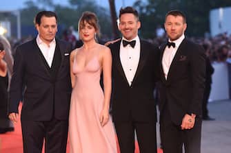 VENICE, ITALY - SEPTEMBER 04:  (L-R) Johnny Depp, Dakota Johnson, director Scott Cooper and Joel Edgerton attend a premiere for 'Black Mass' during the 72nd Venice Film Festival at  on September 4, 2015 in Venice, Italy.  (Photo by Venturelli/WireImage)