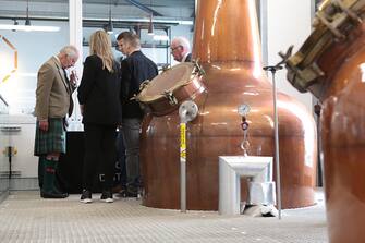 WICK, SCOTLAND - AUGUST 2: King Charles III during a visit to the 8 Doors Distillery in John O'Groats, Wick, in the Scottish Highlands, to officially open the distillery and meet members of the local business community on August 2, 2023 in Wick, Scotland. (Photo by Robert MacDonald - Pool/Getty Images)