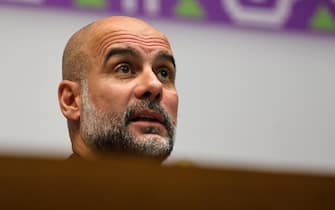 epa11036054 Manchester City manager Pep Guardiola attends a joint press conference at the FIFA Club World Cup in Jeddah, Saudi Arabia, 18 December 2023. Urawa Red Diamonds face Manchester City in the FIFA Clubs World Cup seminfinal on 19 December 2023.  EPA/ALI HAIDER