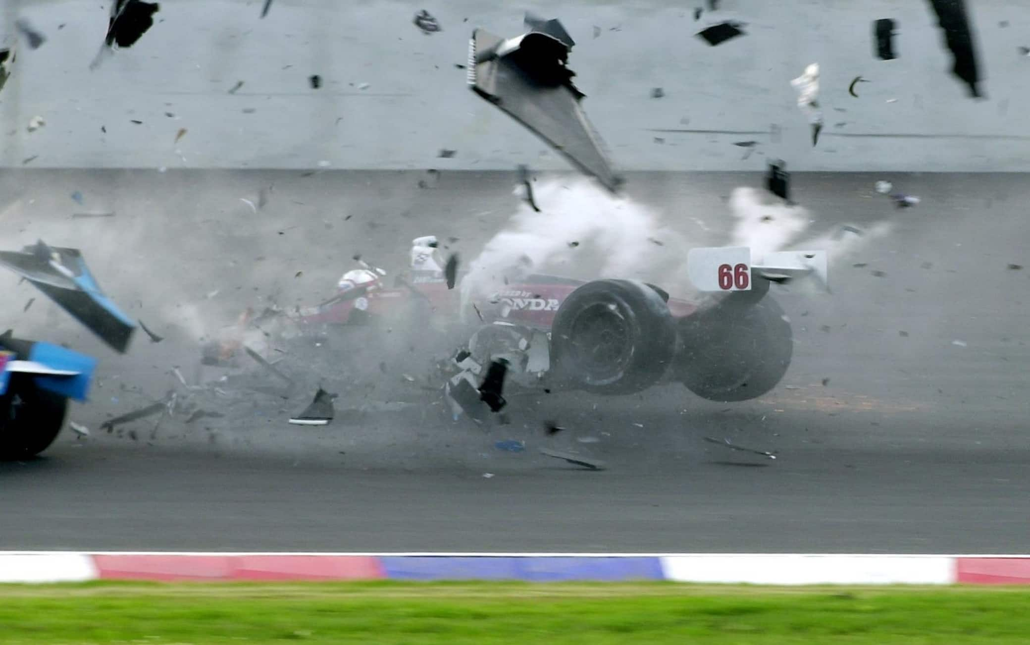 COT10 - 20010915 - KLETTWITZ, GERMANY : The vehicle of the Italian Alex Zanardi (M, Honda Reynard) collides with Canadian Alex Tagliani (l) Saturday 15 September 2001 during the American Memorial on Germany's Brandenburg Lausitz Ring during the exit from the boxes in the champ car motor racing series which made its debut in Europe this weekend.  Zanardi was taken with helicopter to a special clinic in Doberlug-Kirchhain narby and his condition is unknown.  EPA PHOTO DPA/MATTHIAS HIEKEL/mh/hpl-bw