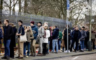 Voters queue outside the Russian embassy as they wait to vote in Russia's presidential elections in The Hague, on March 17, 2024. (Photo by Robin van Lonkhuijsen / ANP / AFP) / Netherlands OUT