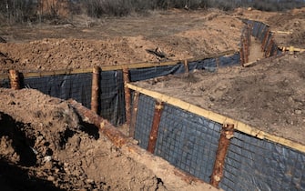 epa11215106 A trench, part of a fortification line under construction at an undisclosed location in the Zaporizhzhia region, Ukraine, 11 March 2024, amid the Russian invasion. Ukraine began to build huge defense lines protecting 2,000 kilometers near the frontline, as confirmed by Ukrainian President Volodymyr Zelensky following a High Command General Headquarters sitting on 11 March.  EPA/KATERYNA KLOCHKO