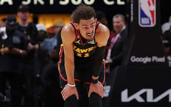 ATLANTA, GEORGIA - APRIL 27:  Trae Young #11 of the Atlanta Hawks reacts after battling for a loose ball against Jayson Tatum #0 of the Boston Celtics during the fourth quarter of Game Six of the Eastern Conference First Round Playoffs at State Farm Arena on April 27, 2023 in Atlanta, Georgia.  NOTE TO USER: User expressly acknowledges and agrees that, by downloading and or using this photograph, User is consenting to the terms and conditions of the Getty Images License Agreement.  (Photo by Kevin C. Cox/Getty Images)