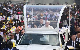 Pope Francis (C on vehicle) arrives by popemobile for the holy mass at the John Garang Mausoleum in Juba, South Sudan, on February 5, 2023. - Pope Francis wraps up his pilgrimage to South Sudan with an open-air mass on February 5, 2023 after urging its leaders to focus on bringing peace to the fragile country torn apart by violence and poverty.
The three-day trip is the first papal visit to the largely Christian country since it achieved independence from Sudan in 2011 and plunged into a civil war that killed nearly 400,000 people. (Photo by Tiziana FABI / AFP) (Photo by TIZIANA FABI/AFP via Getty Images)