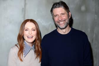 MILAN, ITALY - FEBRUARY 24: Julianne Moore and Bart Freundlich attend the Bottega Veneta fashion show during the Milan Fashion Week Womenswear Fall/Winter 2024-2025 on February 24, 2024 in Milan, Italy. (Photo by Daniele Venturelli/WireImage)