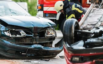 Firefighters At A Car Accident Scene