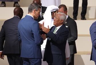 DUBAI, UNITED ARAB EMIRATES - DECEMBER 01: Spanish Prime Minister Pedro Sanchez (L) and Portuguese Prime Minister Antonio Costa chat as leaders arrive for a family photo of heads of state during day one of the high-level segment of the UNFCCC COP28 Climate Conference at Expo City Dubai on December 01, 2023 in Dubai, United Arab Emirates. The COP28, which is running from November 30 through December 12, brings together stakeholders, including international heads of state and other leaders, scientists, environmentalists, indigenous peoples representatives, activists and others to discuss and agree on the implementation of global measures towards mitigating the effects of climate change. (Photo by Sean Gallup/Getty Images)