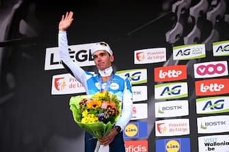 LIEGE, BELGIUM - APRIL 24: Romain Bardet of France and Team dsm-firmenich PostNL on second place poses on the podium ceremony after the 110th Liege - Bastogne - Liege 2024, Men's Elite a 254.5km one day race from Liege to / #UCIWT / on April 24, 2024 in Liege, Belgium. (Photo by Dario Belingheri/Getty Images)