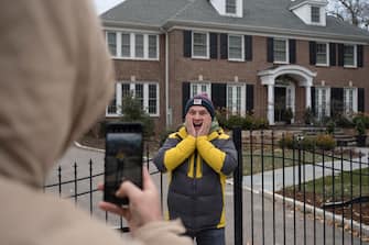 WINNETKA, IL - NOVEMBER 27: Yurii Tkachuk poses for the camera while visiting the house featured in the movie "Home Alone" in Winnetka, Illinois on Nov. 27, 2021. (Photo by Youngrae Kim for The Washington Post via Getty Images)