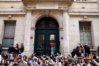 epa11308364 Pro-Palestinian demonstrators gather outside the Sorbonne University, where they tried to set up a protest camp before being evacuated by police in Paris, France, 29 April 2024. More than 34,300 Palestinians and over 1,455 Israelis have been killed, according to the Palestinian Health Ministry and the Israel Defense Forces (IDF), since Hamas militants launched an attack against Israel from the Gaza Strip on 07 October 2023, and the Israeli operations in Gaza and the West Bank which followed it.  EPA/MOHAMMED BADRA