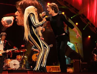 NEWARK, NJ - DECEMBER 15:  Lady Gaga and Mick Jagger of The Rolling Stones performs at the Prudential Center on December 15, 2012 in Newark, New Jersey. (Editorial Use Only) The Rolling Stones concert is being telecast live worldwide via pay-per-view at 9pm EST/6pm PST.  (EDITORIAL USE ONLY)  (Photo by Kevin Mazur/WireImage)