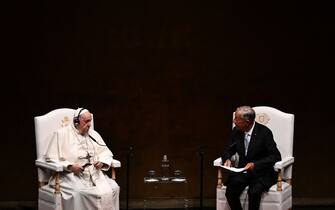 Pope Francis (L) and Portuguese President Marcelo Rebelo de Sousa hold a meeting with authorities, civil society, and the diplomatic corps at the Belem district's cultural centre in Lisbon, during his five-day visit to attend the World Youth Day (WYD) gathering of young Catholics, on August 2, 2023. Pope Francis arrived in Lisbon today to gather with a million youngsters from across the world at the World Youth Day (WYD), held as the Church reflects on its future. The 86-year-old underwent major abdominal surgery just two months ago, but that has not stopped an event-packed 42nd trip abroad, with 11 speeches and around 20 meetings scheduled. (Photo by Marco BERTORELLO / AFP) (Photo by MARCO BERTORELLO/AFP via Getty Images)