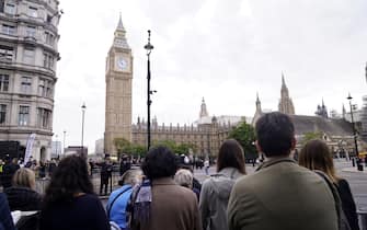 Members of the public in Westminster, central London, ahead of the ceremonial procession of the coffin of Queen Elizabeth II from Buckingham Palace to Westminster Hall, London. Picture date: Wednesday September 14, 2022.