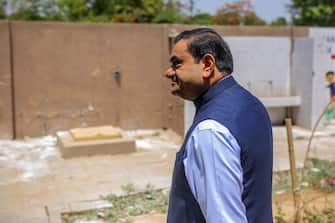 Gautam Adani, chairman of Adani Group, arrives at a polling station during the third phase of voting for national elections in Ahmedabad, Gujarat, India, on Tuesday, May 7, 2024. Voting kicks off in Prime Minister Narendra Modi's home state of Gujarat in the third phase of India's election Tuesday, with campaigning becoming increasingly acrimonious between the two main parties. Photographer: Dhiraj Singh/Bloomberg via Getty Images