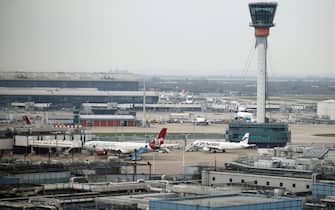 epa11978065 A Virgin Atlantic and a Finnair planes parked at Heathrow Airport in London, Britain, 21 March 2025. Heathrow Airport on 21 March announced it would be closed all day, following a power outage 'due to a fire at an electrical substation supplying the airport'.  EPA/TOLGA AKMEN